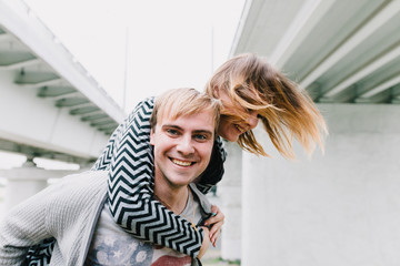 Fototapeta premium Two lovers walk around the park, kiss and hug, a love story.