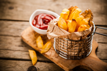 French fries on wooden table
