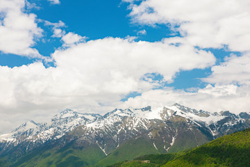 Amazing views in the Caucasus mountains. Snow-capped peaks, blue sky, sunny day