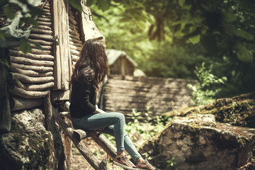 woman siting and look on forest