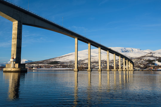 Bridge on high pillars connecting the islands around the fjors of Tromsø, Norway