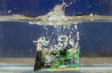 Circuit board submerged in the water