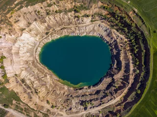 Fensteraufkleber Aerial view of a crater of a minig pit © nikolay100