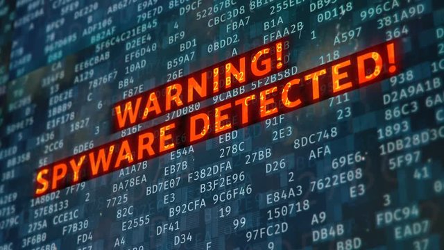 Spyware detected, red warning message on monitor, system under attack. Computer malware detected