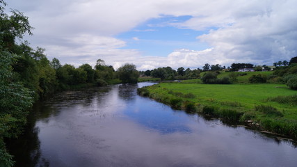 Fototapeta na wymiar landscape with river and irish blue sky