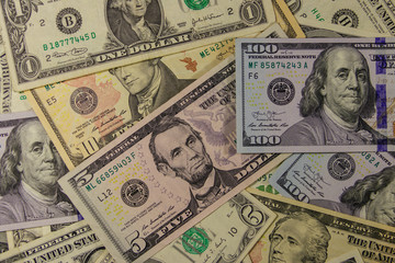 Background of different dollar banknotes