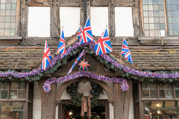 Royal Family British Christmas decorations with old oak beams Union jack flags red white and blue...