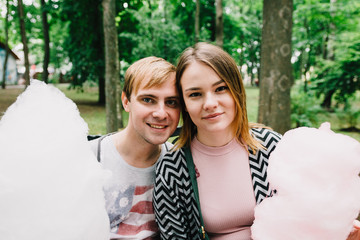 Obraz premium Two lovers walk around the park, kiss and hug, a love story.
