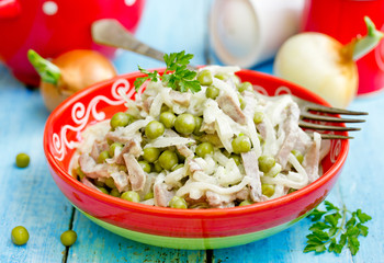 Meat salad with canned green peas and pickled onion