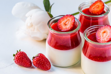 Light milk, dietary dessert with strawberries. Panna cotta. The concept of a healthy diet.