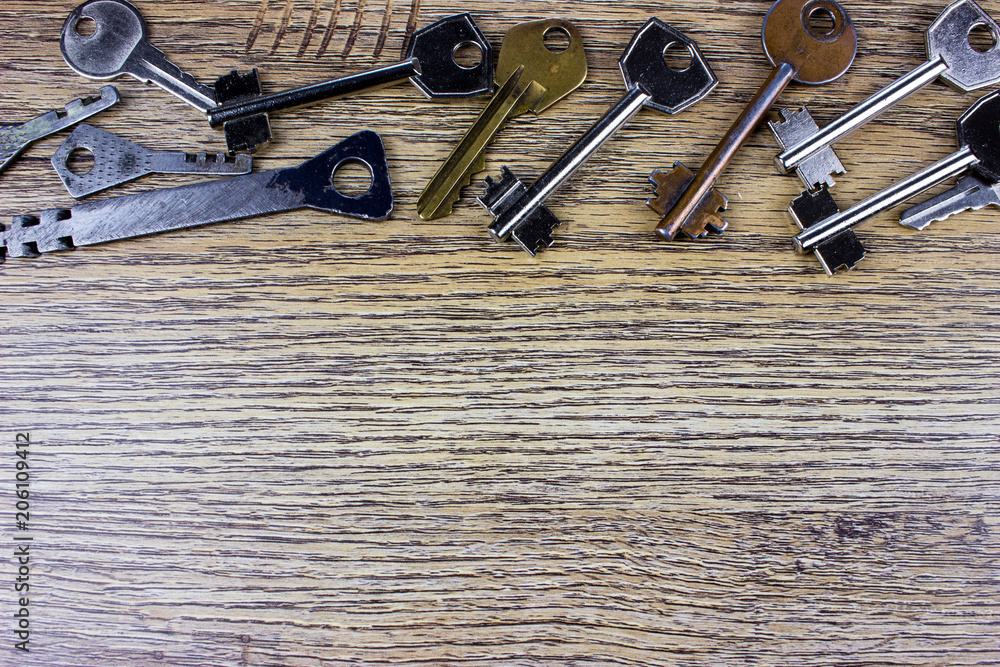 Fototapete many different keys in oder on wooden background concept. two keys ion blue texture. empty space for