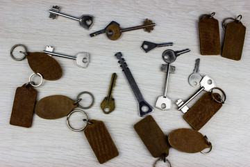  many different keys in oder on wooden background concept
