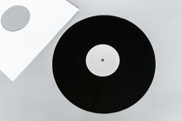 Vinyl LP on Gray Background Surface with Copy Free Space and White Envelope Near it