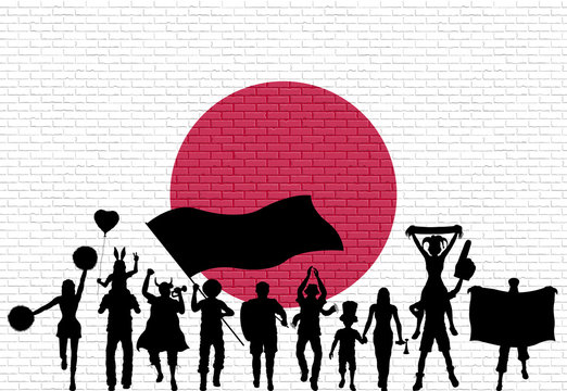 Japanese supporter silhouette in front of brick wall with Japan flag