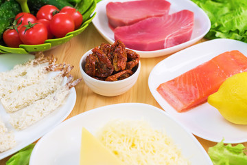 A close-up of the ingredients for the preparation of Caesar salad related to the kitchen. Home kitchen. Useful and tasty food