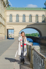 Fototapeta premium Sunny day, beautiful girl on the waterfront