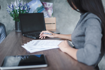 Woman hand signing a contract