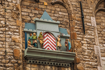 Balcony and carillon with mechanical puppets next to gothic City Hall building of Gouda in a cloudy...