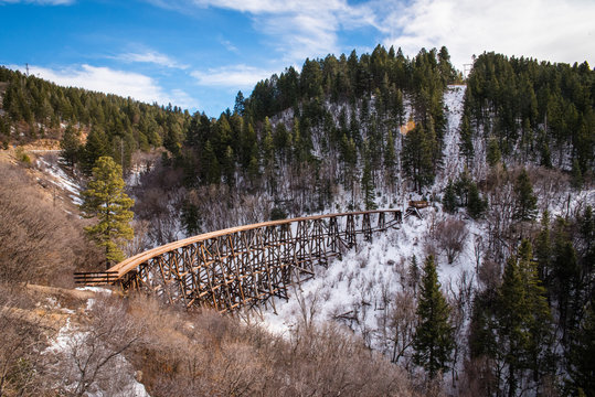 An old wooden trestle running through the mountains in New Mexico. 