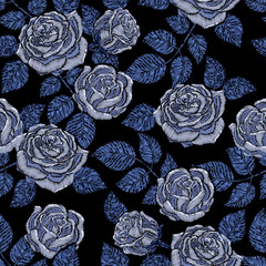 Embroidery seamless pattern texture, wallpaper, background with beautiful blue roses. Vector floral ornament on black background. Template for printing, textiles, design
