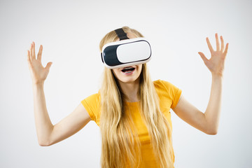 Girl wearing virtual reality goggles.