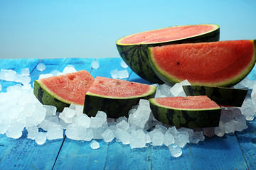 watermelon on blue background. juicy summer fruit in slices