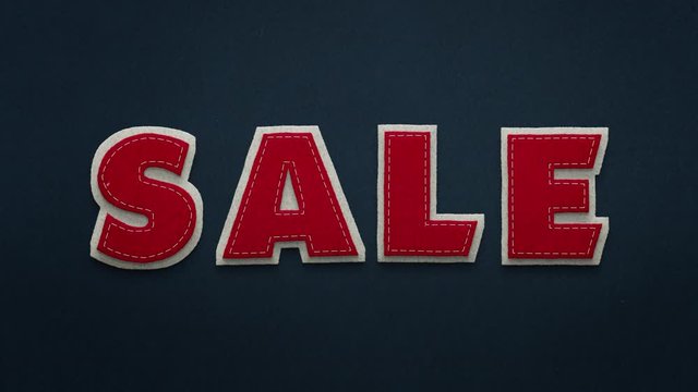Das Wort "Sale" auf Filz in stop motion Technik.