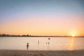 A Young Girl Looking at the Ocean, water, pretty sky, sunset