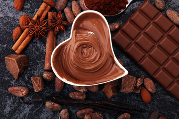 Chocolate bars on table with chocolate powder.