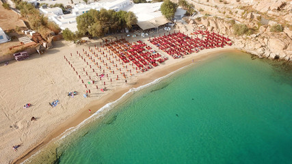 Aerial drone, bird's eye view photo of iconic and famous beach of Super Paradise with sapphire clear waters, Mykonos island, Cyclades, Greece