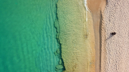 Aerial drone, bird's eye view photo of iconic and famous beach of Super Paradise with sapphire...