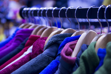 Multi-colored fleece jackets in the outdoor store