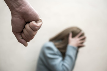 Man beating up his wife illustrating domestic violence