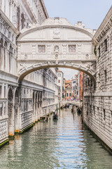 Fototapeta na wymiar View of the Bridge of Sighs (Ponte dei Sospiri) and the Rio de Palazzo o de Canonica Canal from the Riva degli Schiavoni in Venice, Italy. The Ponte de la Canonica is visible in background.
