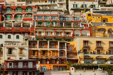 Fototapeta na wymiar Stacked Houses with Balconies in Positano at the Italian Amalfi Coast in the Evening Sun