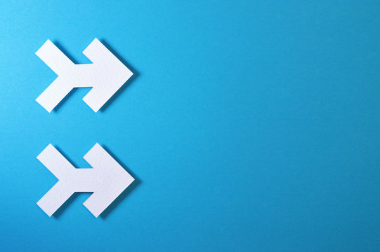 two arrows on blue background