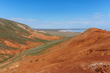 Unusual red mountain Bogdo in the steppe. Astrakhan region, near lake Baskunchak, Russia