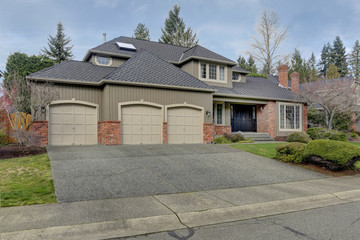 Luxury home exterior with three car garage.