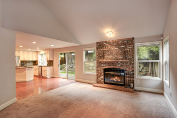 Living room with traditional fireplace.