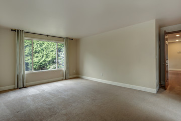 Empty bedroom with carpet floor.