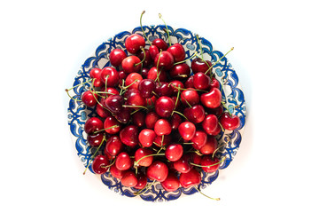 isolated cherry in the blue plate