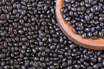 Black beans. Wooden background - Phaseolus vulgaris' Black turtle