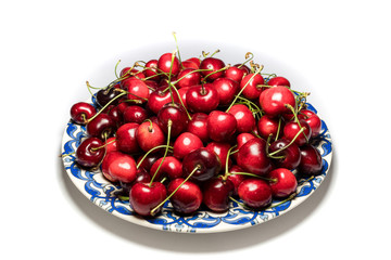 isolated cherry in the blue plate