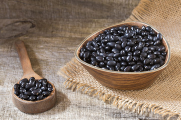 Black beans. Wooden background - Phaseolus vulgaris' Black turtle