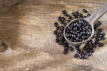 Black beans. Wooden background - Phaseolus vulgaris' Black turtle