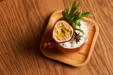 Spicy Mule cocktail on bar table. Alcoholic beverage drink with Rum angostura, reserve rum, dry orange passionfruit ,pure, pineapple pure, spice syrup ingredients, close-up
