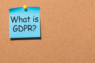 What is General Data Protection Regulation or GDPR - note at blue paper pinned to office cork board with copy space for text, template or mock-up