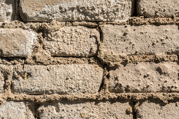 texture of the old wall of brick blocks, scattered brick and brickwork, architecture abstract background