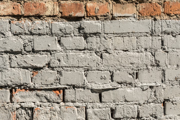texture of the old wall of brick blocks, scattered brick and brickwork, architecture abstract background