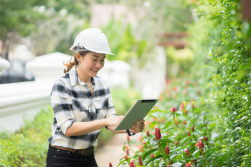 environment engineer with tablet ,inspection in workplace for architectural plan,sketching a constructions project at construction site,Business concept vintage color